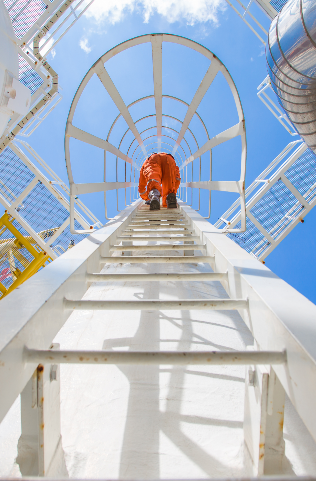 Maintenance Engineer going up a ladder