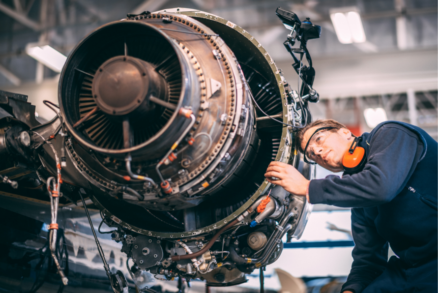 Engineer giving maintenance to an airplane's engine after an unexpected failure
