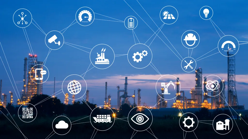 Industrial plant at dusk overlaid with a network of connected icons for sensors, cameras, gauges, robotics, logistics, cloud and safety.