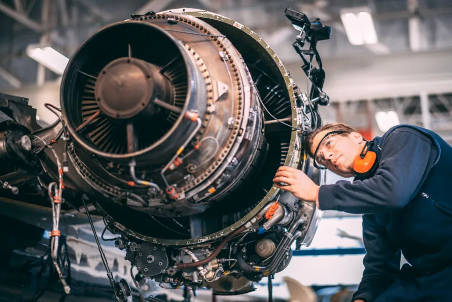 Easy Insights in Failures, Causes and Expected Consequences Engineer giving maintenance to an airplane's engine after an unexpected failure
