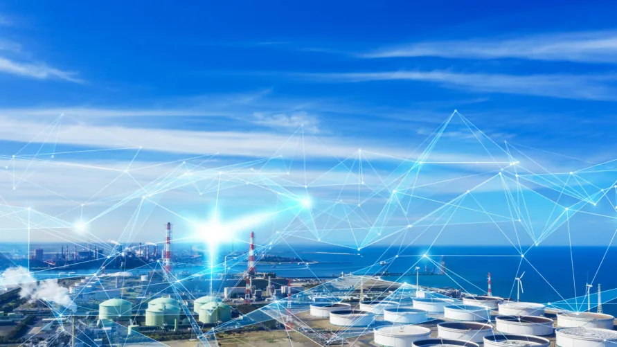 Industrial coastline with refineries, storage tanks and wind turbines, overlaid with a glowing network of connected lines.