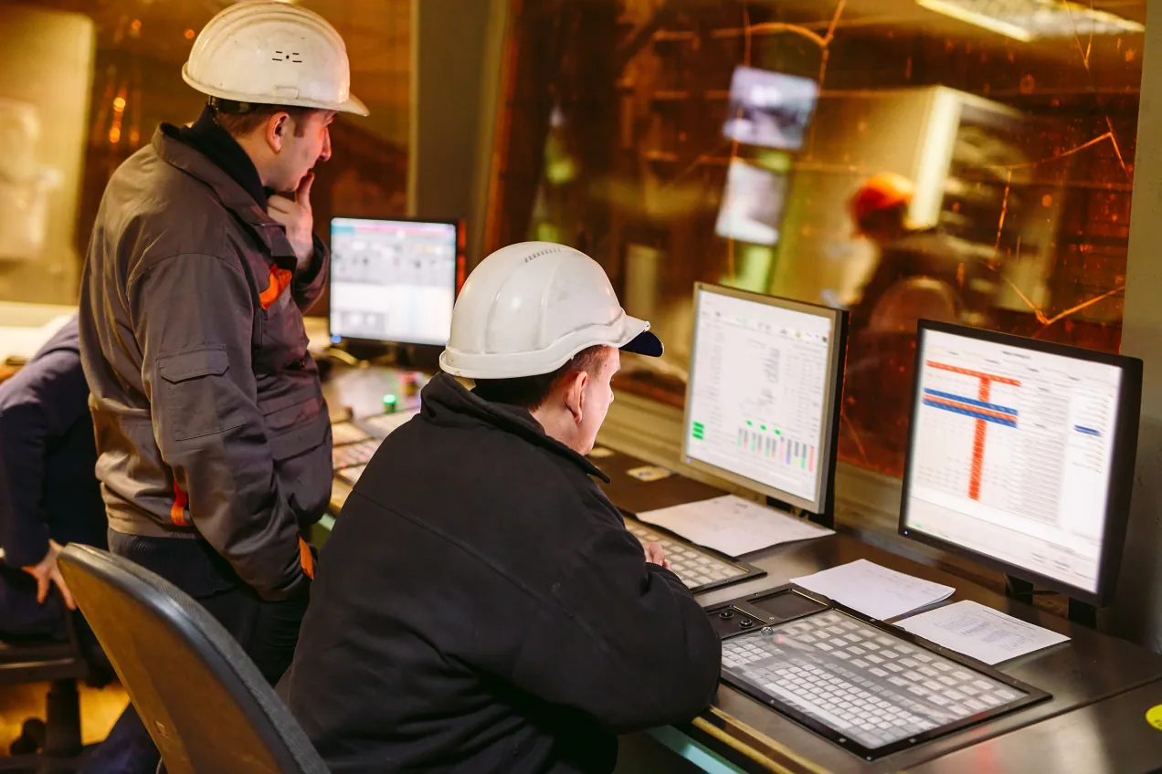 It is Turnaround Time! Engineers looking at the control panel