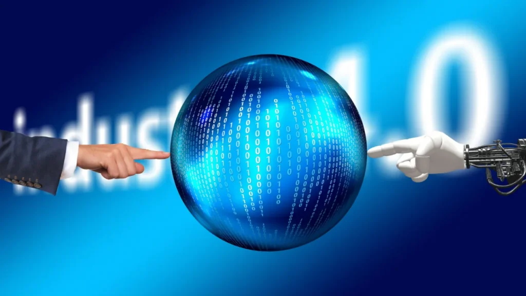 A human hand and a robotic hand reaching toward a glowing globe of binary digits, against the words Industry 4.0.