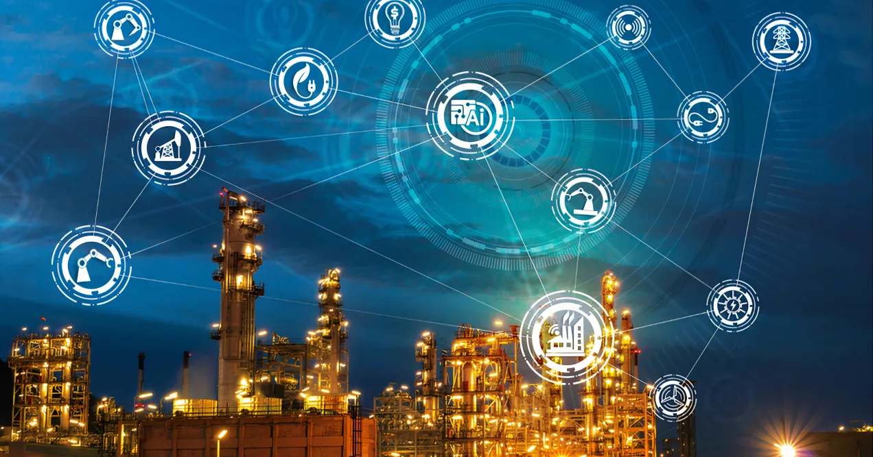 The Industrial Internet of Things – Hype or Reality? Futuristic smart factory with illuminated industrial infrastructure connected through digital IoT icons and AI integration, representing the Industrial Internet of Things in manufacturing.
