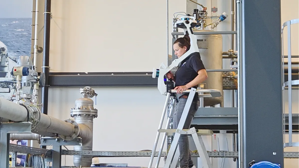 UReason Joins Forces with FCoE, Smart AIS & Samp to Build a Smarter Flow Facility Smart AIS scanning engineer using NavVis VLX wearable system to capture 3D data at the Flow Center of Excellence for Shared Reality modeling