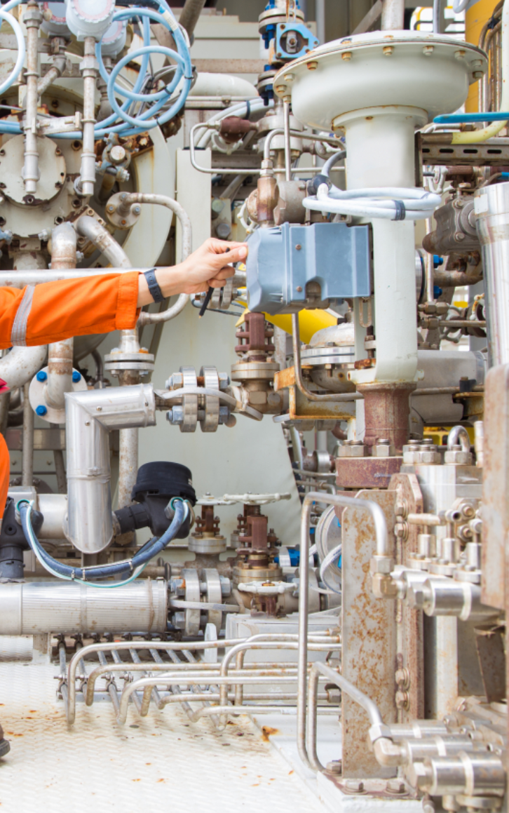 An engineer is checking a control valve at the plant