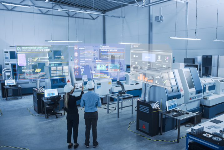 Two engineers viewing an analytics screen